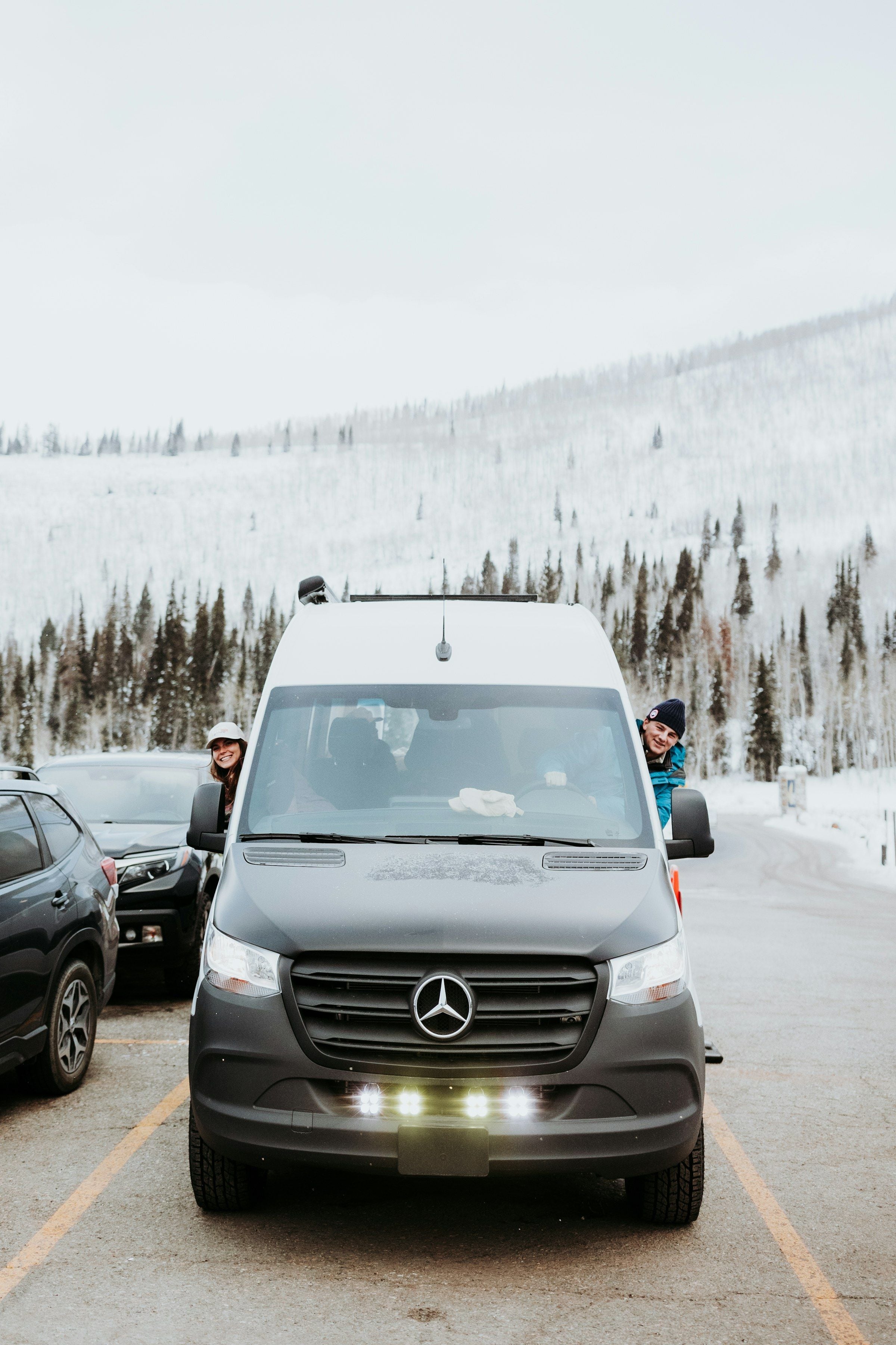 Front of a modern minibus parked on a winter road